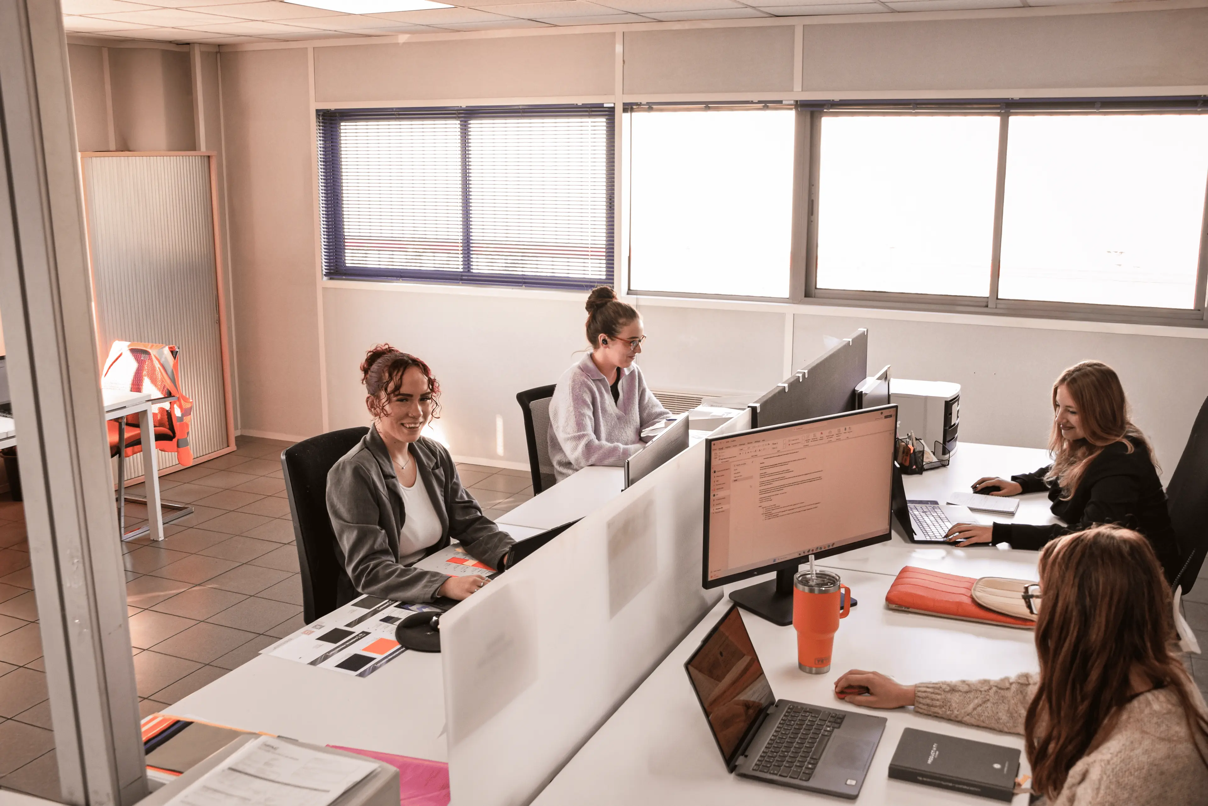 Professionals in safety gear working at an industrial site